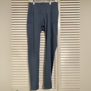 Dark blue green size small leggings from The Gym People.